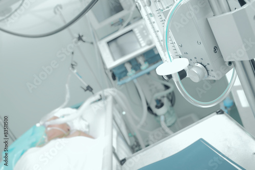 Patient receiving mechanical ventilation in a hospital ward