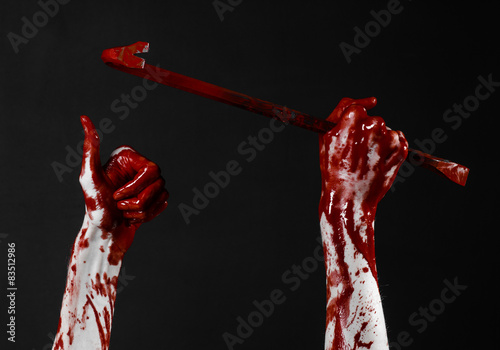 Bloody hands with a crowbar, hand hook, black background