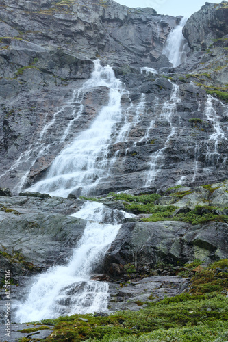 Waterfall in summer mountain