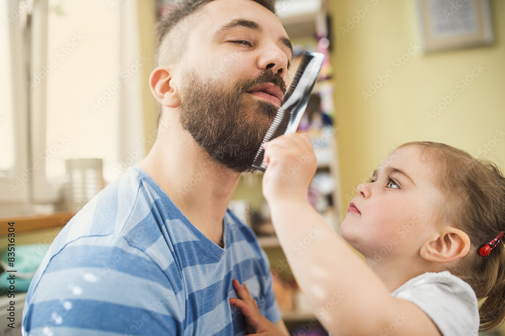 Young father spending time with his little daughter at home Young father spending time with his little daughter at home