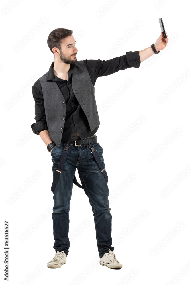Bearded stylish man taking self portrait profile view Bearded stylish man taking self portrait profile view
