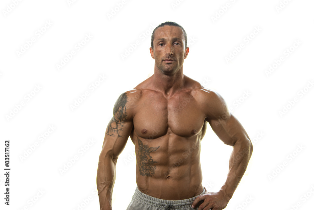 Muscular Bodybuilder Guy Posing Over White Background