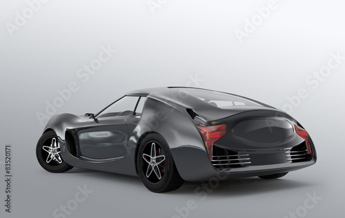 Rear view of gray sports car on gray background.