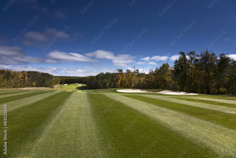 View up the fairway at a golf course. View up the fairway at a golf course.