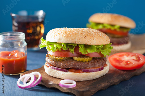 burger with beef patty lettuce onion tomato ketchup