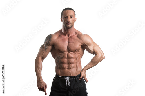 Muscular Bodybuilder Guy Posing Over White Background