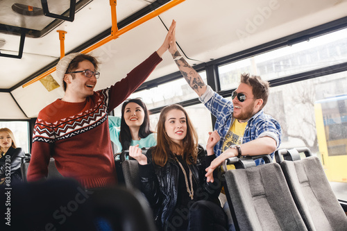  Friends on the bus ride to travel. give five,