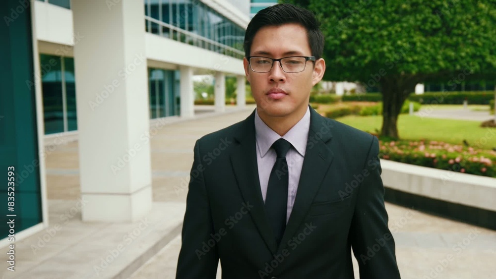 Chinese Businessman Commuter Walking To Office Building Chinese Businessman Commuter Walking To Office Building