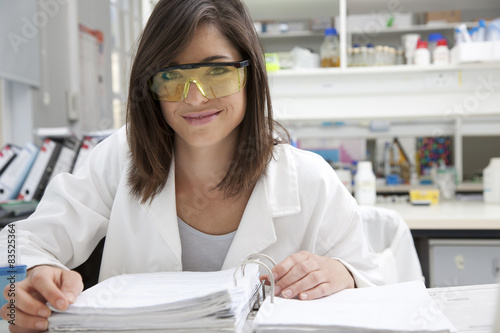 Female technician studying in laboratory photo