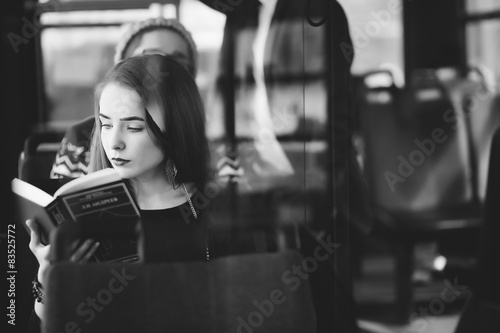 Woman on the bus reading a book