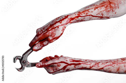 bloody hand holding a pliers on a white background