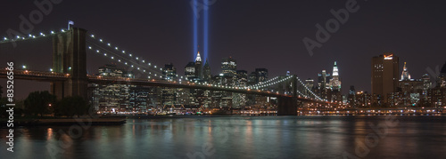 USA, New York, New York City, Illuminated skyline with Brooklyn Bridge blue rays of light #83526566