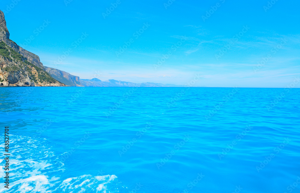 blue water in Orosei Gulf under a clear sky, Sardinia