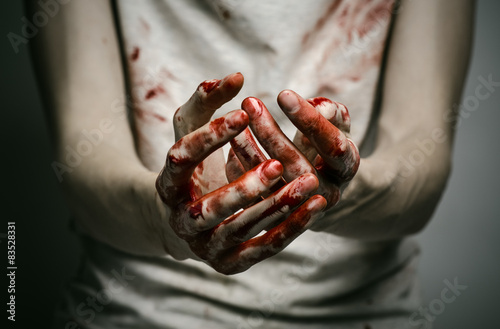 murderer shows bloody hands and experiencing depression and pain © Parad St