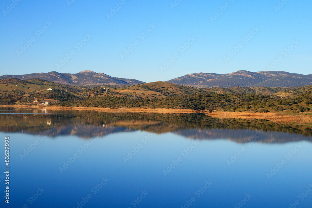 Sky reflected in the lake formed by Montoro dam