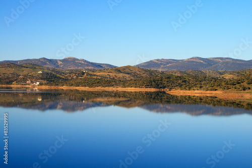 Sky reflected in the lake formed by Montoro dam