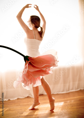 Canada, Quebec, Montreal, Young female Ballerina dancing with Blooming Flower appearing as tutu photo