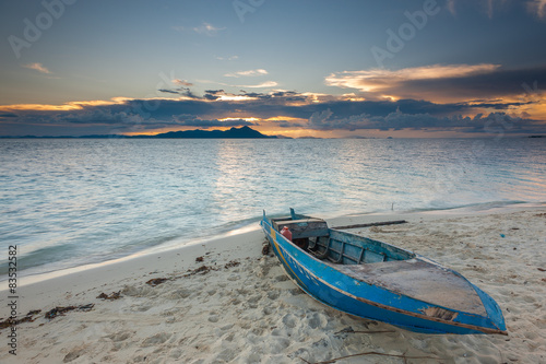 Malaysia, Sabah, Sampan on beach at sunset