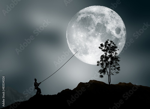 Man pretending to steal moon photo