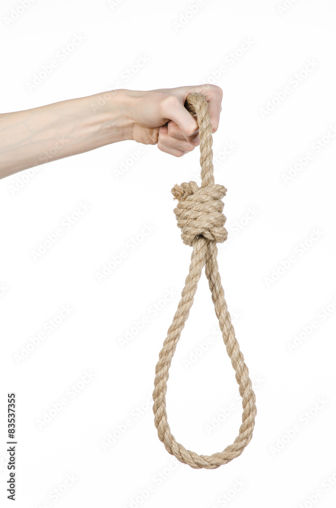 man's hand holding a loop of rope for hanging on isolated man's hand holding a loop of rope for hanging on isolated