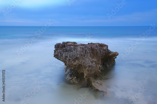 Australia, Pearse's Beach, Rock in blue sea photo