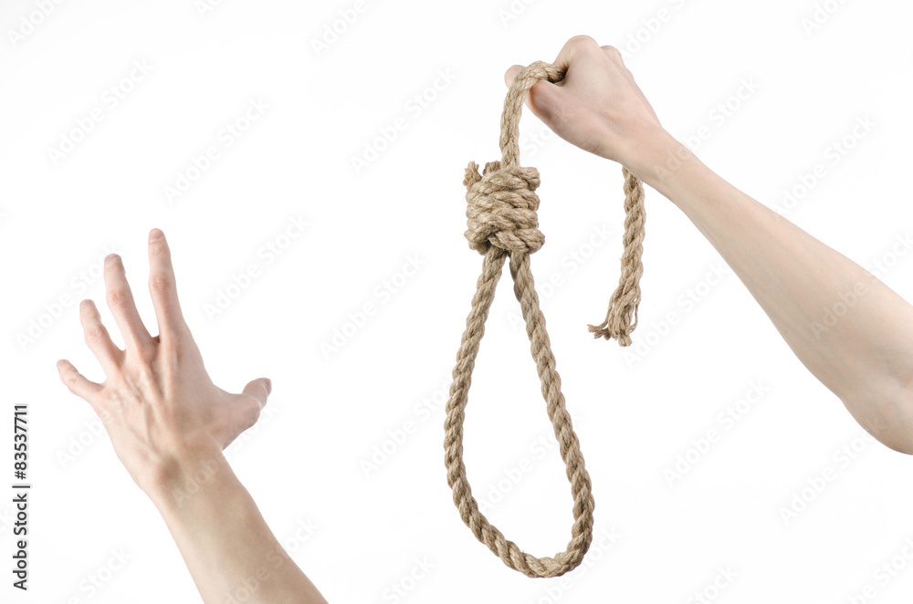 man's hand holding a loop of rope for hanging on isolated man's hand holding a loop of rope for hanging on isolated