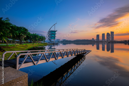 Malaysia, Putrajaya, Pullman, Sunrise at jetty on lake photo