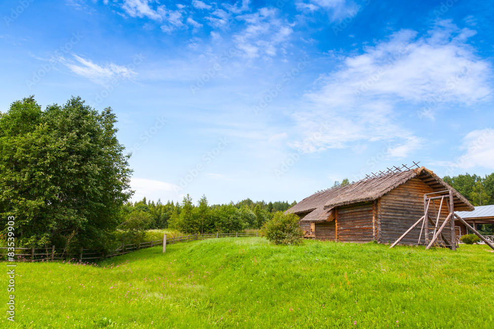 Russian rural landscape with old wooden barns Russian rural landscape with old wooden barns