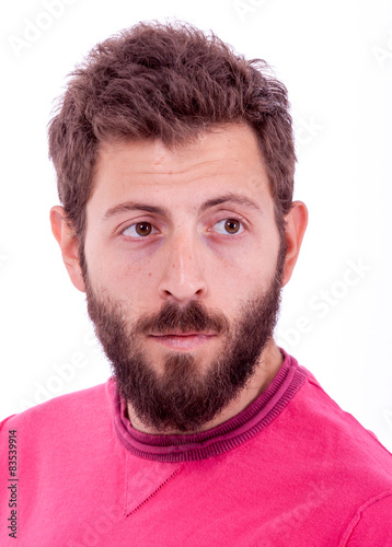 Smiling young man with beard posing