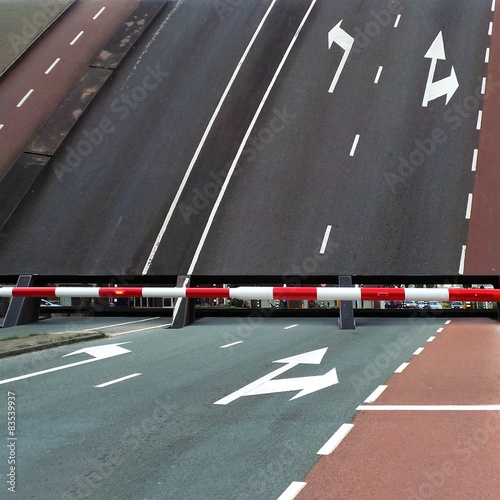 Close-up of a bascule bridge opening with the safety barrier in place 