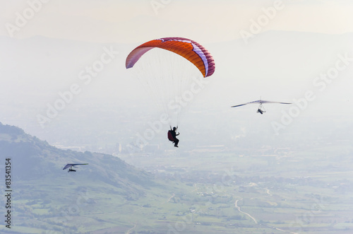 Paraglider and two pilot gliders