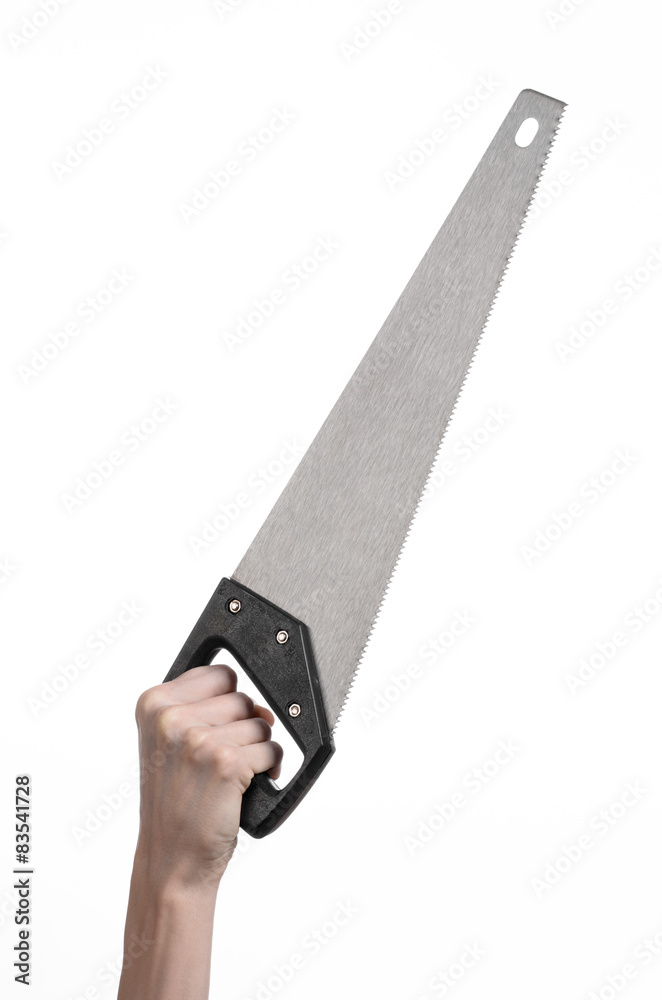 hand holding a saw with a black pen white background isolated hand holding a saw with a black pen white background isolated