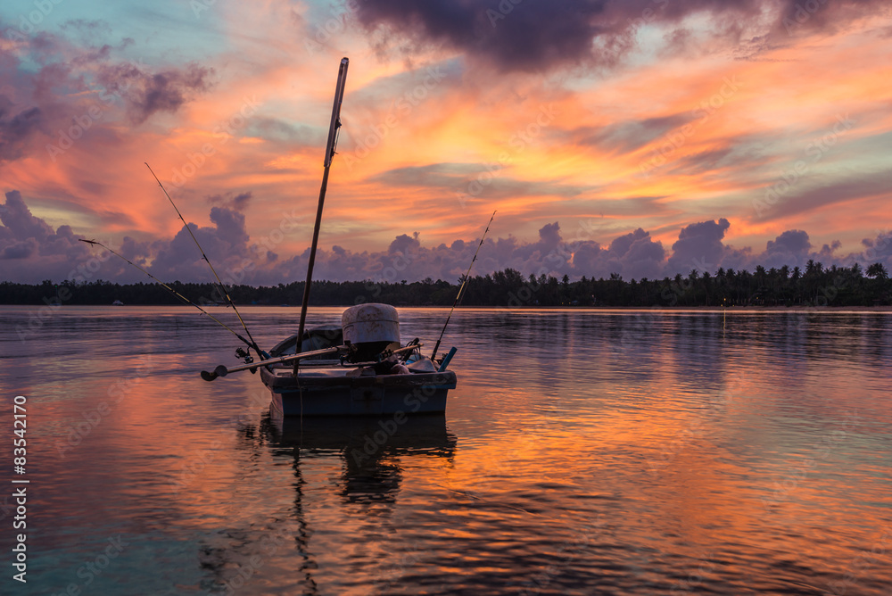 Vivid morning sky with floating boat Vivid morning sky with floating boat