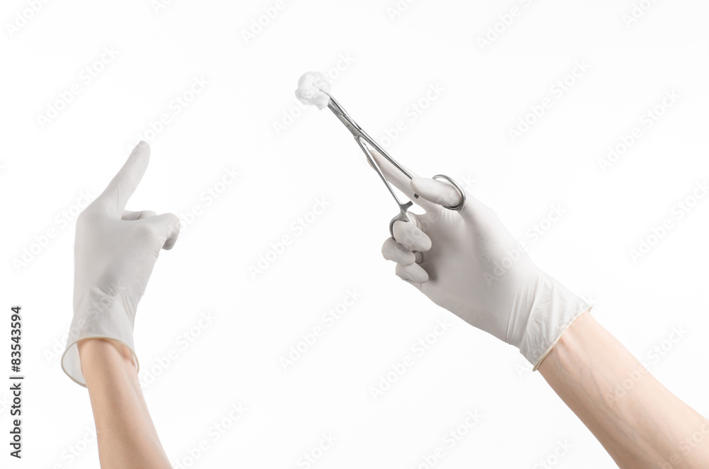 doctor's hand holding a surgical clip with a bloody tampon Stock Photo |  Adobe Stock