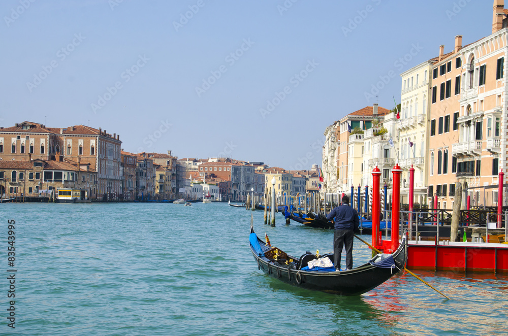 Gondolier at Grand Canal, Venice, Italy and sunny day