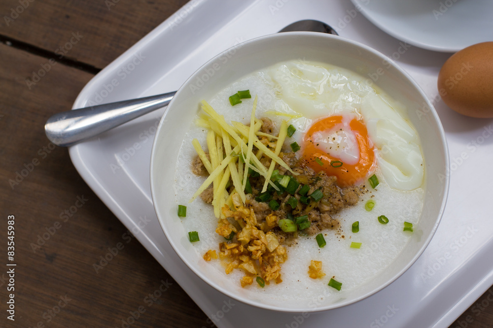 Congee of traditional food Chinese style with soft-boiled egg Congee of traditional food Chinese style with soft-boiled egg