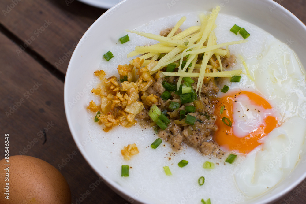 Congee of traditional food Chinese style with soft-boiled egg Congee of traditional food Chinese style with soft-boiled egg