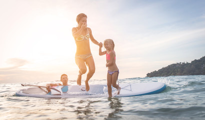 happy family diving in the water