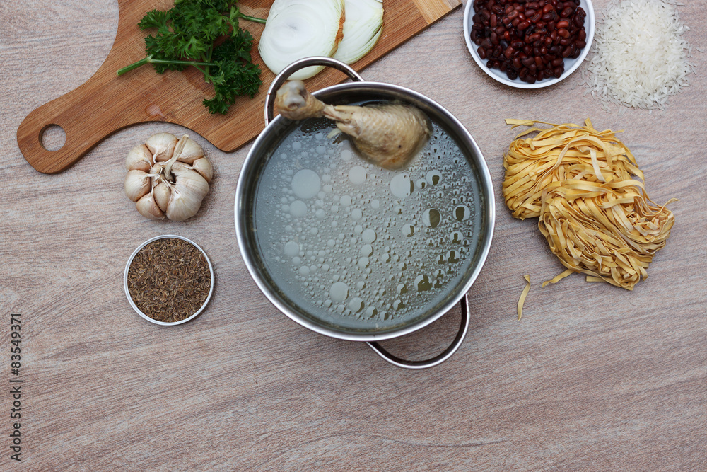 Chicken soupwith fresh vegetables, noodles and beans