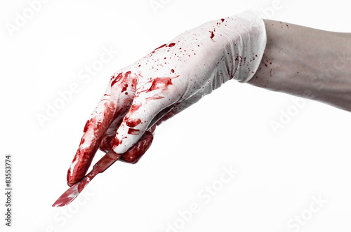 Bloody hands in gloves with the scalpel, white background