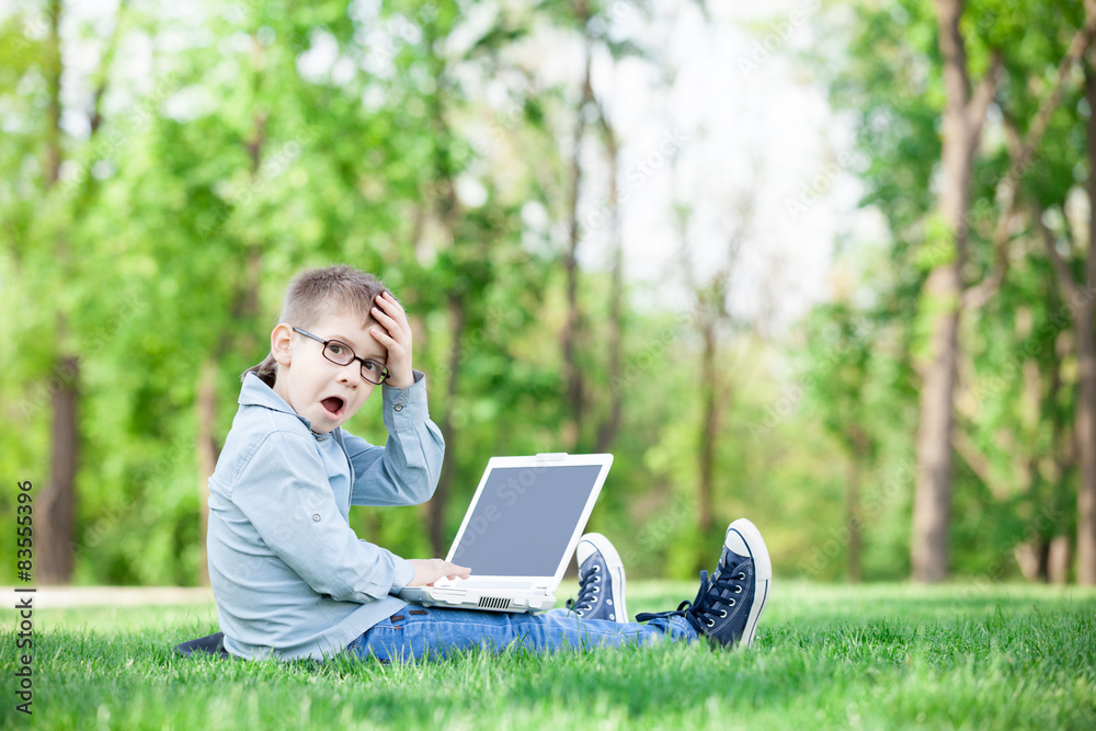boy with a books and laptop computer boy with a books and laptop computer