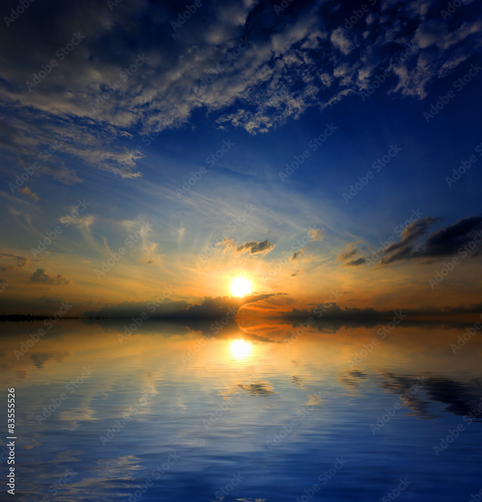 Fototapeta premium sunset over water surface