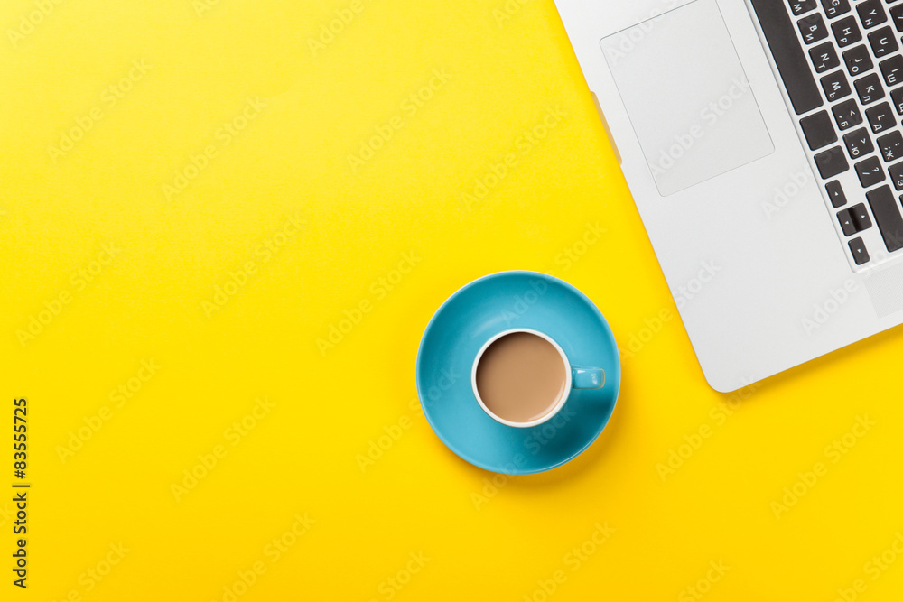 Cup of coffee and laptop computer Cup of coffee and laptop computer