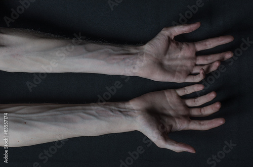 Gothic horrible Halloween theme: thin hands of death