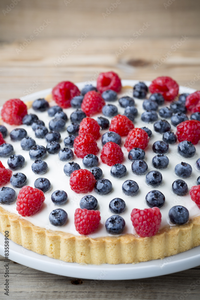 Cake with blueberries and raspberries. Confectionery product. Cake with blueberries and raspberries. Confectionery product.