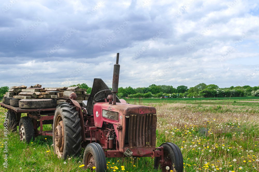 Abandoned Old Red Farm Tractor in Meadow Abandoned Old Red Farm Tractor in Meadow