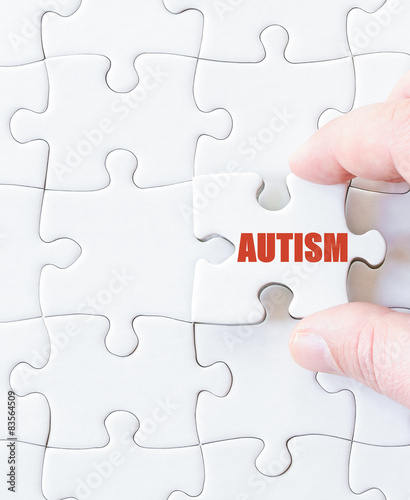 Obraz na płótnie Missing jigsaw puzzle piece with word AUTISM w salonie