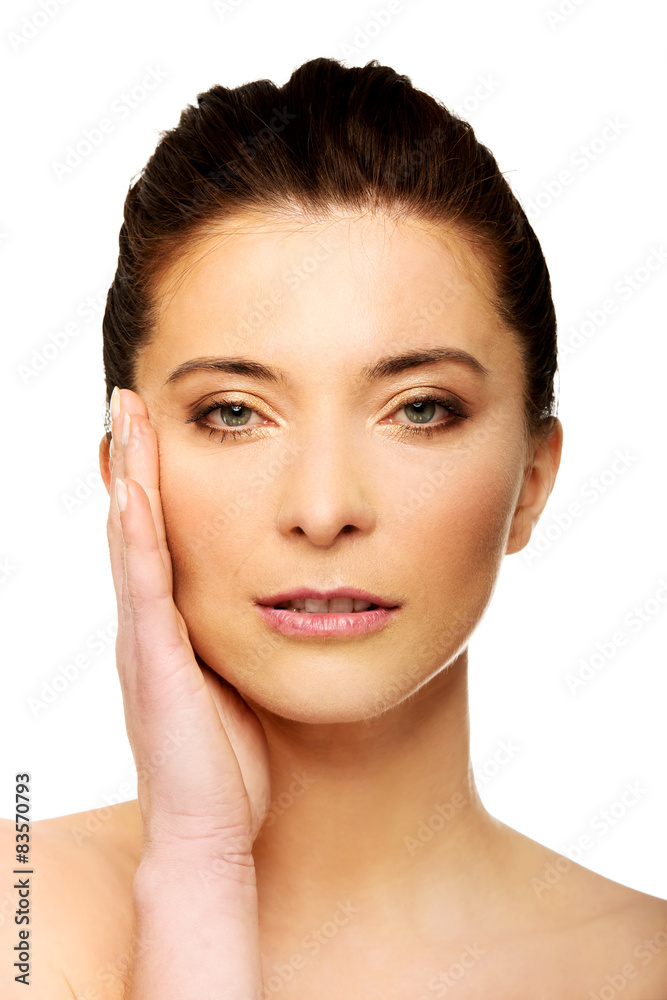 Spa woman with make up touching her face. Spa woman with make up touching her face.