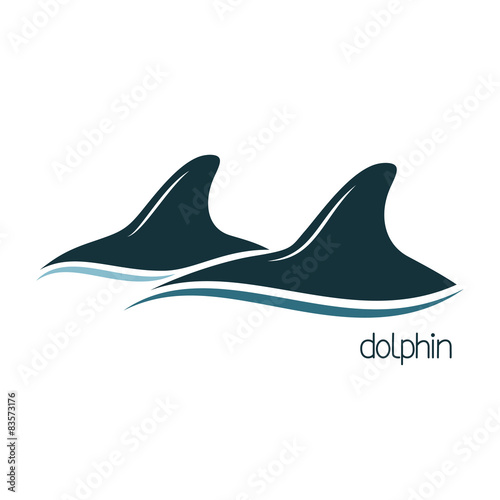 Dolphins dorsal fins above the water