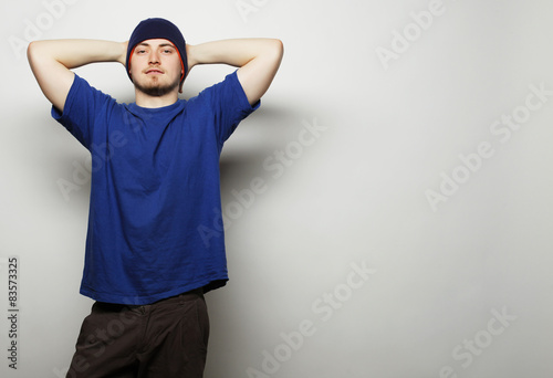 man in blue t-shirt and blue hat.